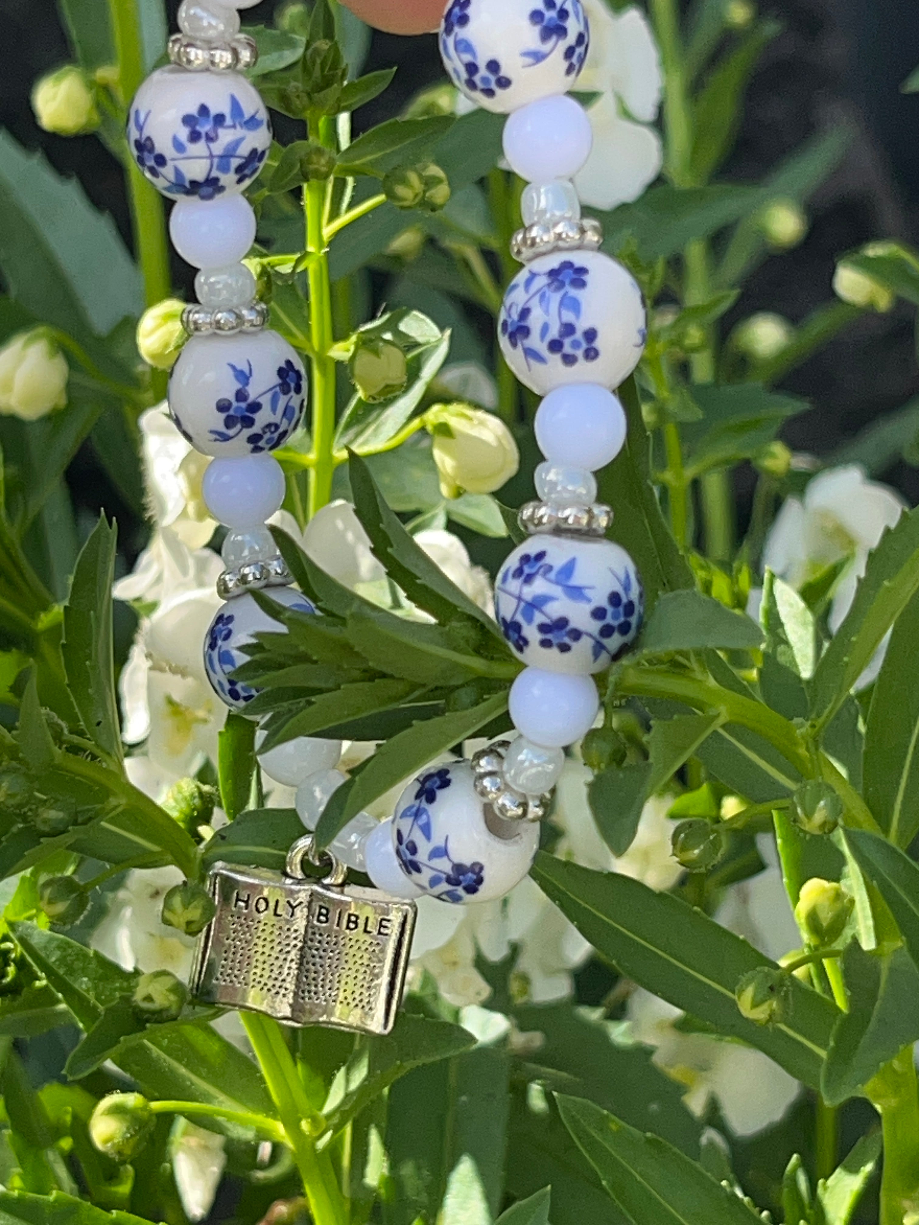 Holy Bible floral bead bracelet worn on wrist